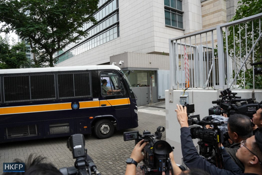 A Correctional Services Department vehicle pulls into the West Kowloon Law Courts Building on May 30, 2024, where three judges will deliver their verdict to 16 defendants involved in the city's largest national security case. Photo: Kyle Lam/HKFP.