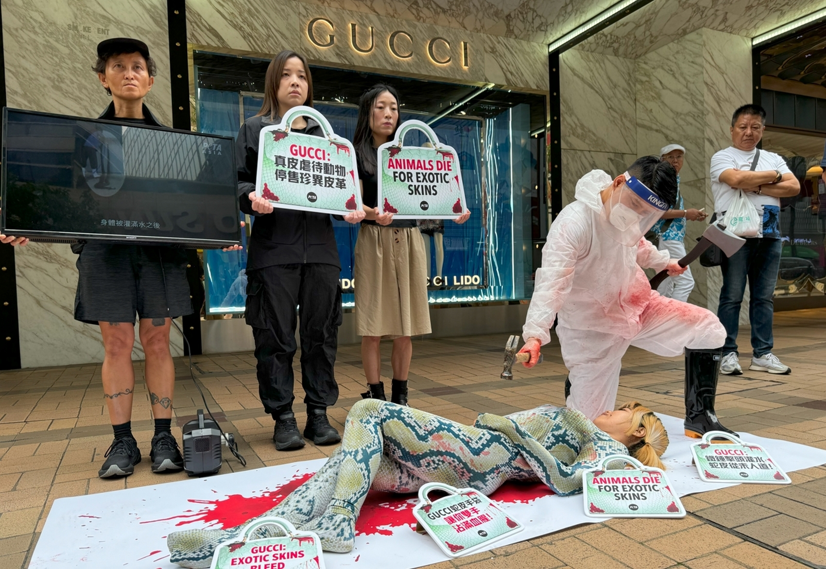 Activists from PETA protest the use of exotic skins by Gucci and parent firm Kering